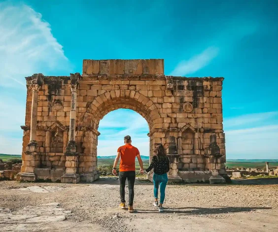 couple-in-Volubilis-a-Berber-Roman-city-in-Morocco-day-trip couple in Volubilis a Berber-Roman city in Morocco day trip
